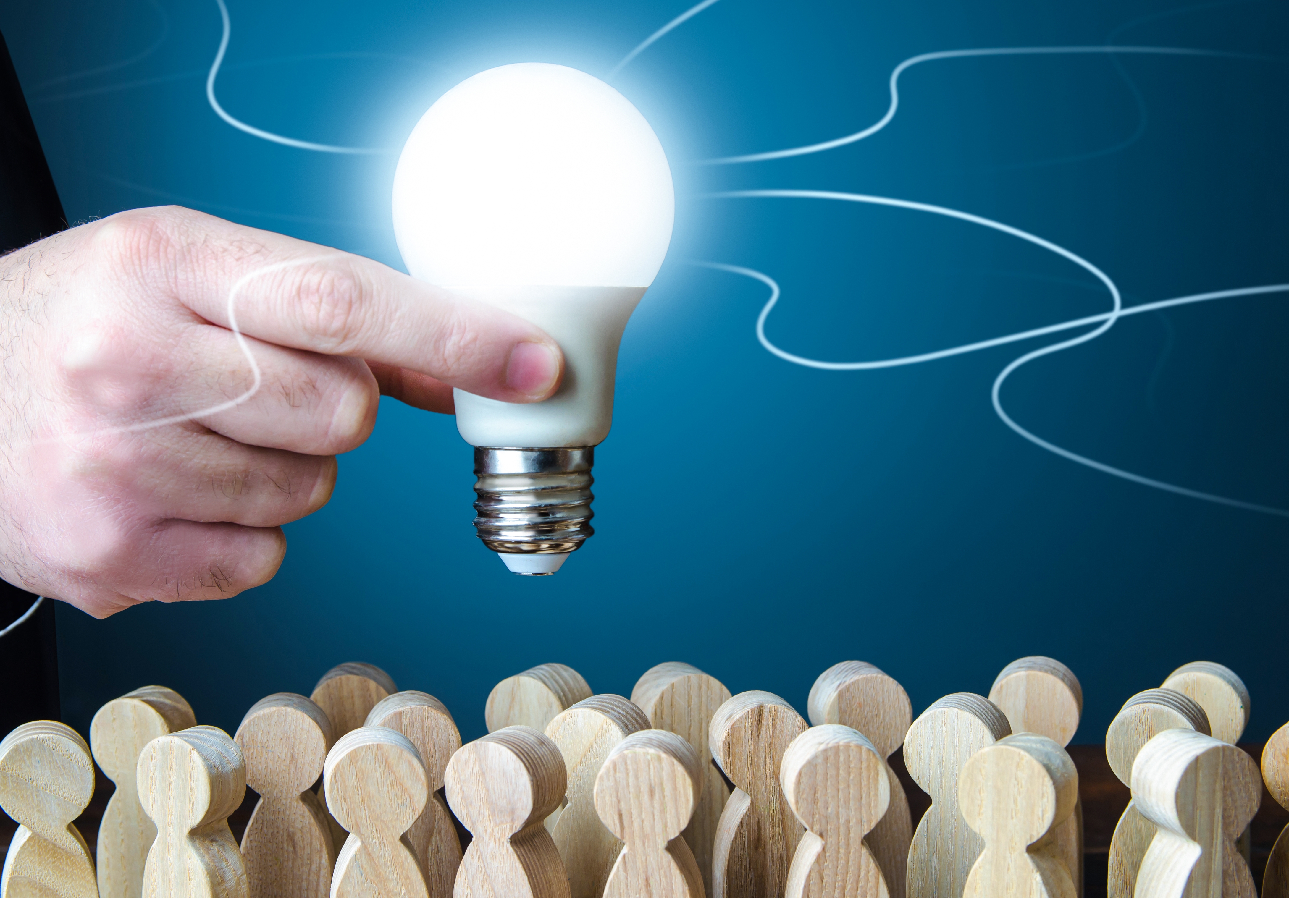 a-man-holds-an-idea-light-bulb-above-the-crowd-2025-03-18-17-38-01-utc